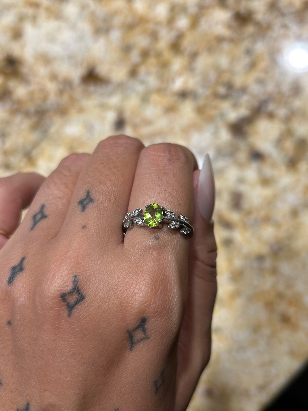 Sterling Silver Peridot Ring with Leaf Accent